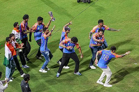 Players of Indian cricket team dance during their felicitation ceremony